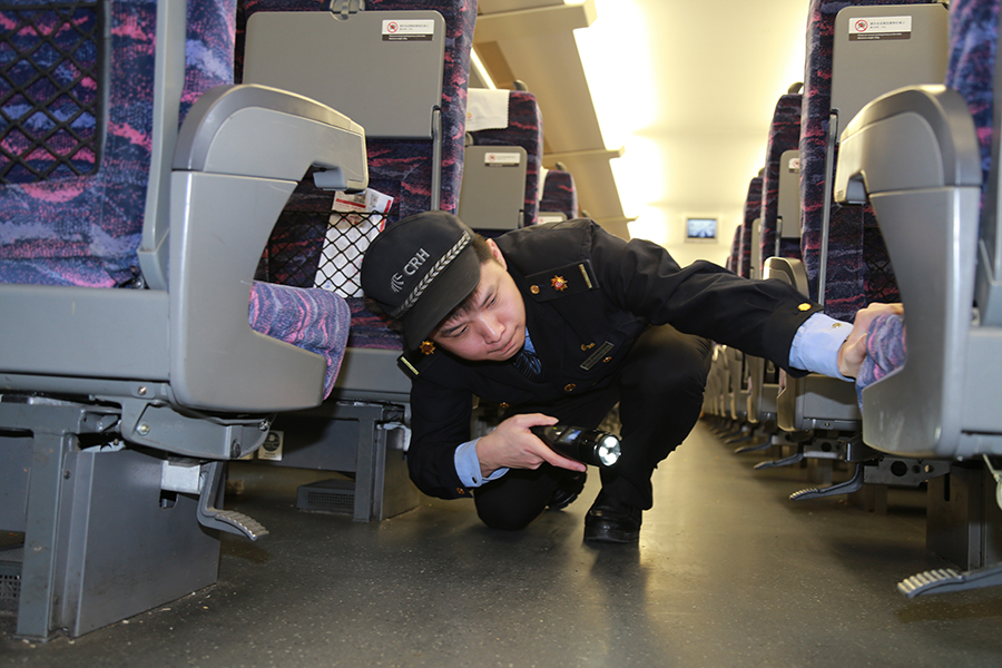 Attendants work in a standby bullet train