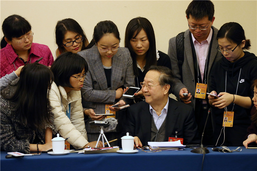 Political advisor takes questions after group meeting