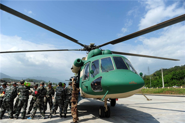 PLA aircraft fly in supplies to quake zone