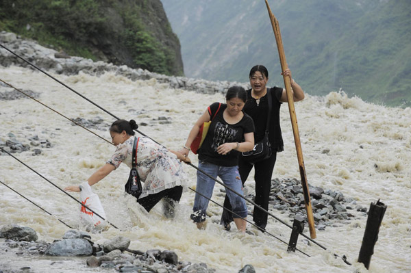 Cave-ins hinder efforts to repair damaged highway