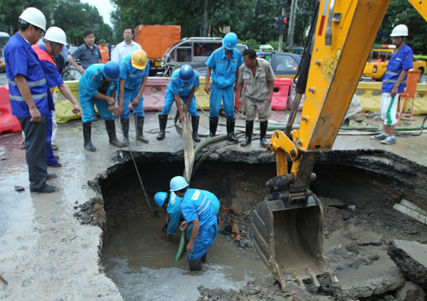 Pavement collapses in heavy rains