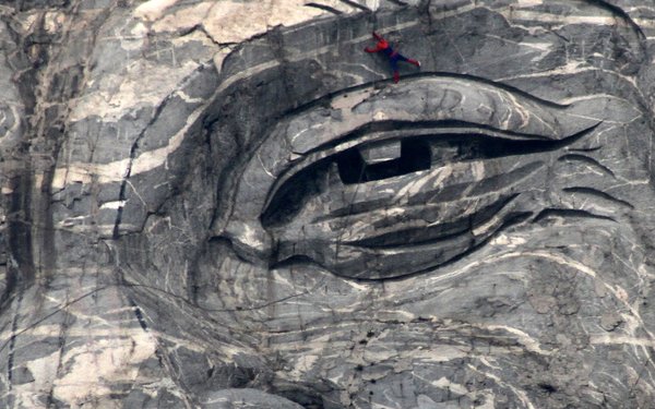 'Spiderwoman' faints after cleaning huge stone carving