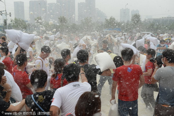 Feathers fly as pillow fight relieves stress of daily life