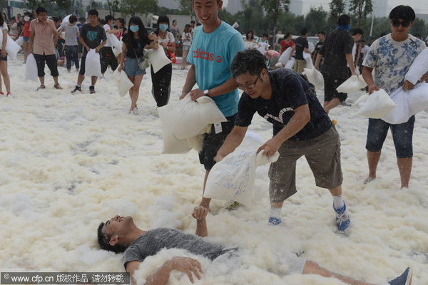 Feathers fly as pillow fight relieves stress of daily life