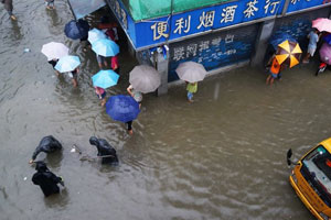 Rescuers pluck residents from raging torrent