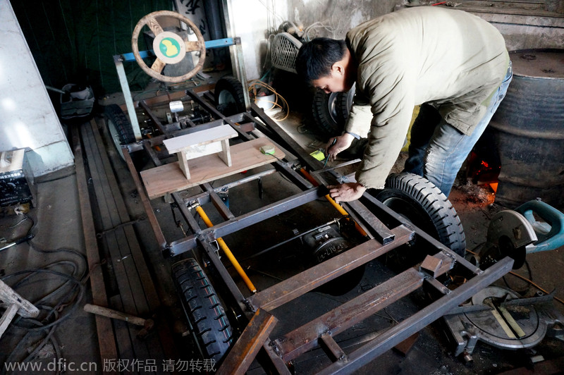 Carpenter carves armored vehicle from wood