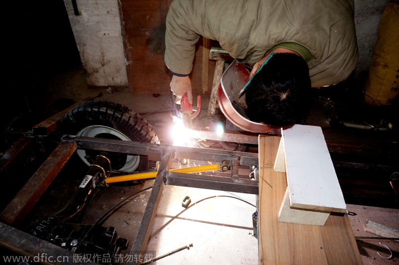 Carpenter carves armored vehicle from wood