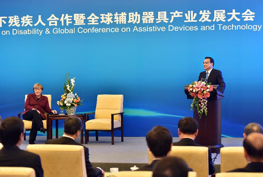 Li Keqiang, Merkel attend meeting on disability in Beijing