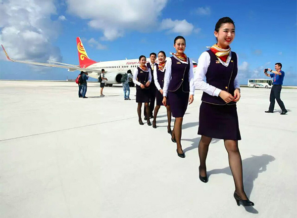 Chinese stewardess celebrate test flight at Nansha Islands airfield