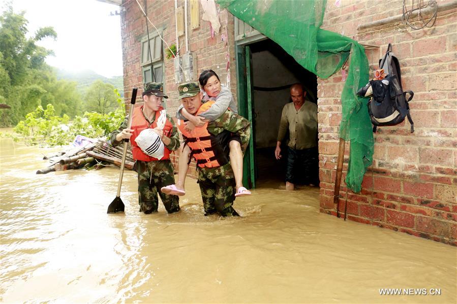 13 dead, 13 missing in China rain, landslides