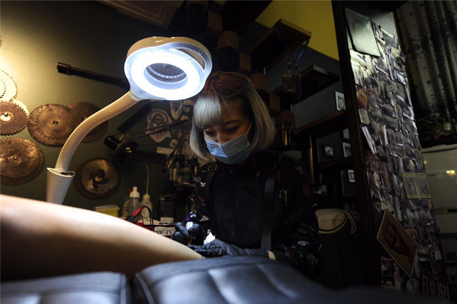 Young tattooist defies stereotype