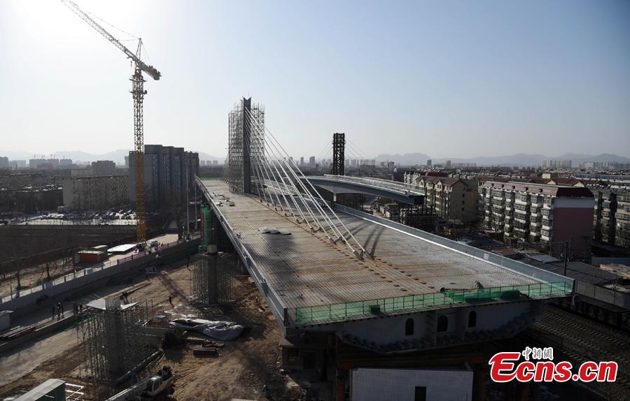 World's longest single axis bridge swings into place