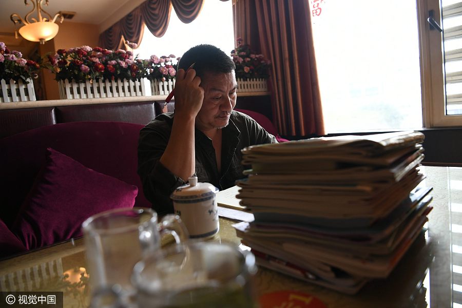 50-year-old attempts <EM>Gaokao </EM>for 21st time