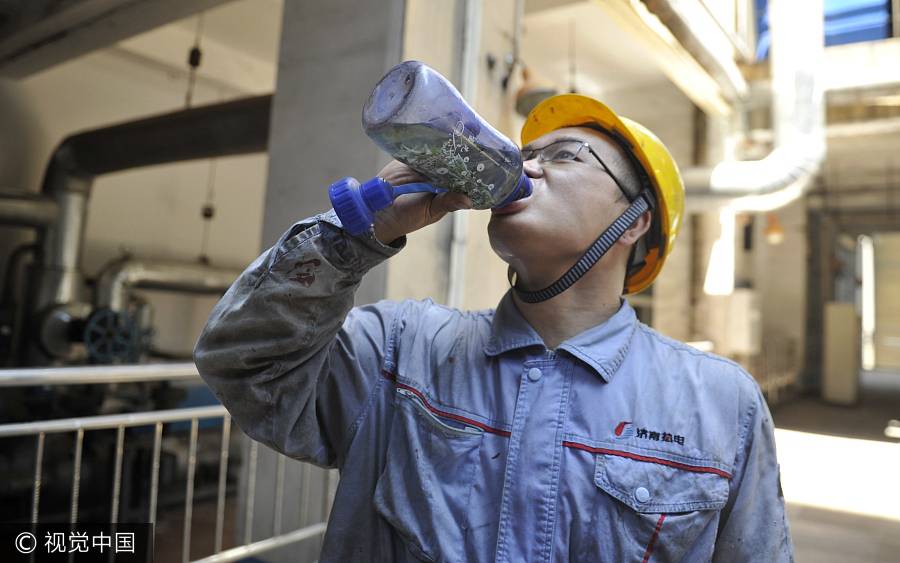 Workers stick to their job in baking sun