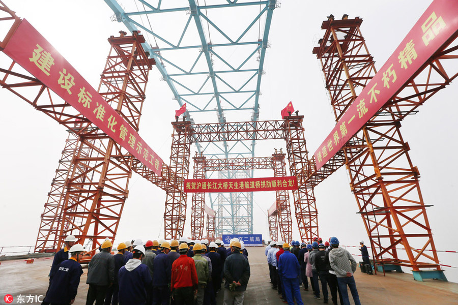 Arch of world's longest cable-stayed bridge joined