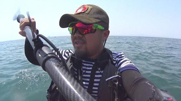 Man kayaks along China's coastline