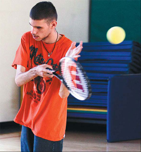 Schools teach adapted tennis to blind players