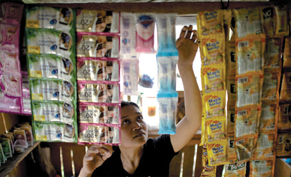 Aid helps typhoon widow to support family with tiny store