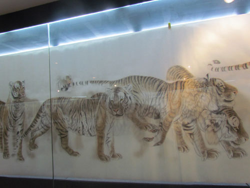 Lifelike tiger paintings on display