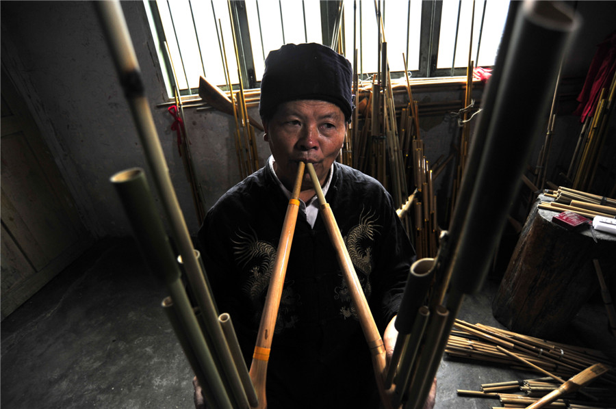 Inheritor of reed-pipe wind instrument 'Lusheng' in Guizhou