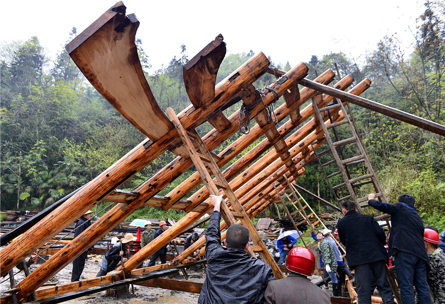 Ceremony held to start construction on a Tujia stilted house in C China