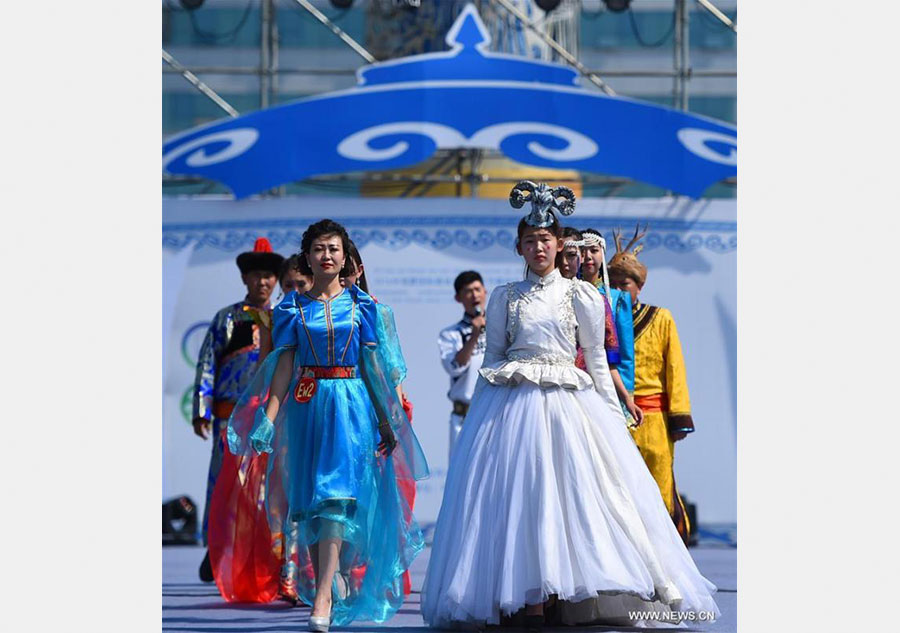 Models present costumes in China's Inner Mongolia