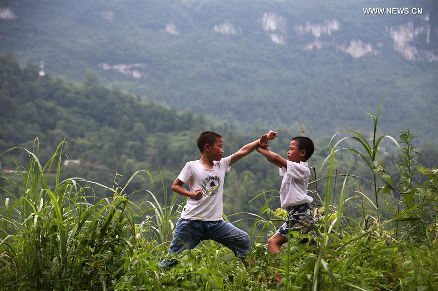 Children learn about Chinese Wushu during summer vacation in SW China