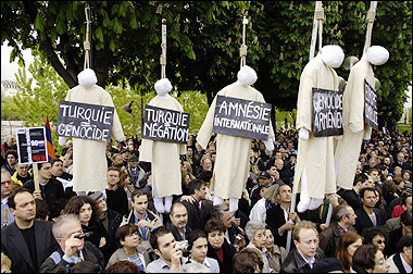 People attend commemorations marking the 90th anniversary of Armenian genocide in Paris. The Armenian community in France and elsewhere in Europe held solemn masses, marches and memorials to mark the 90th anniversary of mass killings by Ottoman Turks which a growing number of countries have recognised as a genocide.(AFP