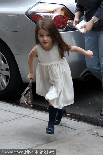 Katie Holmes and Suri seen leaving a house