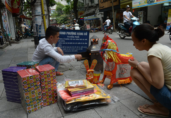 Vietnamese furnish ancestors with jets, rollers and mansions