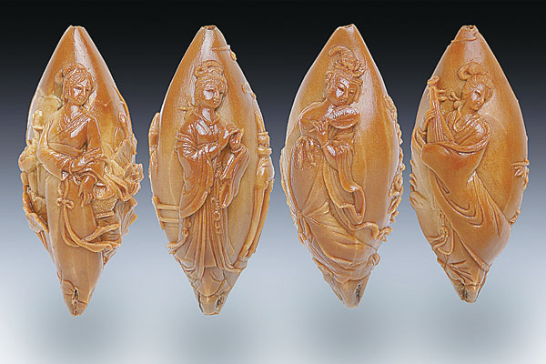 Traditional carvers shape kernels of art