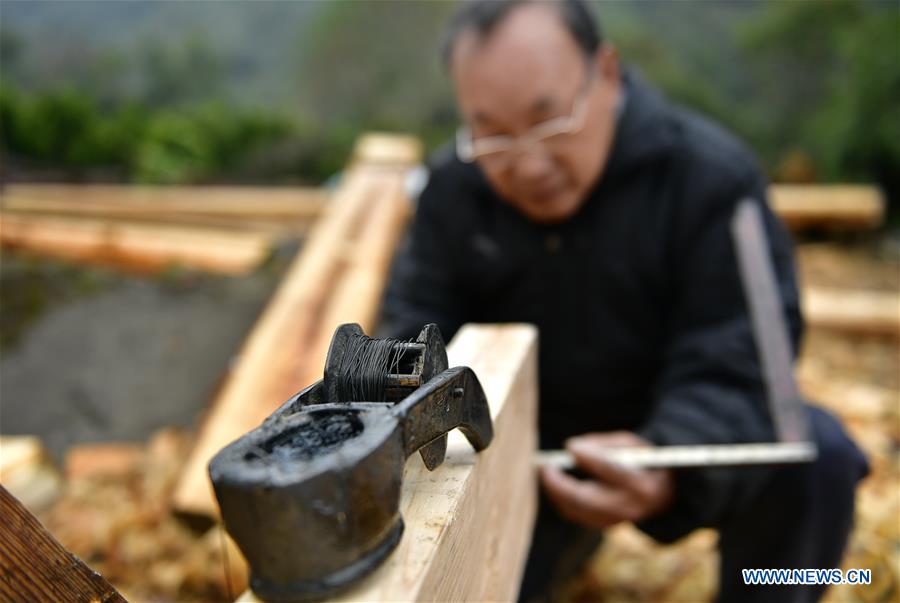 Architect of stilted house of Tujia people