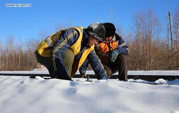 Railway workers on duty to ensure safety during holiday travel rush