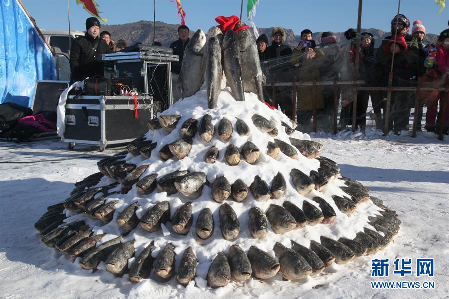 Winter fishing on frozen Zimeng Lake in Chifeng