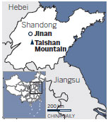 Porters see a steep drop on Taishan Mountain