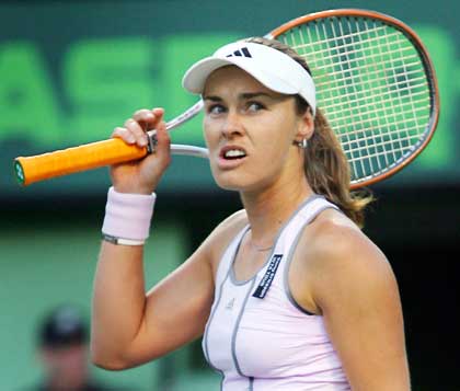 Hingis of Switzerland looks over at her coach during her match against Kuznetsova of Russia at Nasdaq-100 Open in Florida 