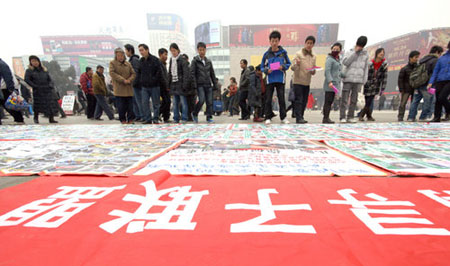 Poster with photos of 2,700 missing children