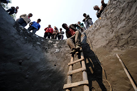 Villagers work around the clock for water