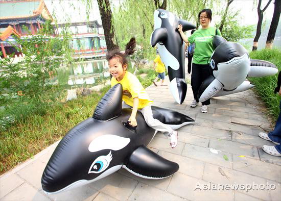 Kids release 'whales' in Beijing