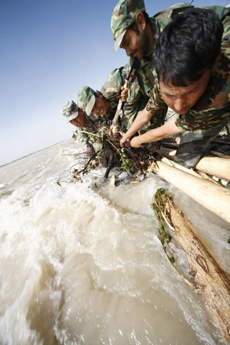 Ongoing efforts to strengthen breached dyke