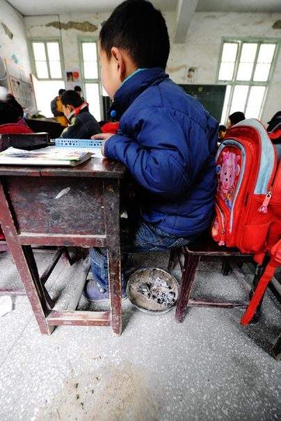 Pupils take up books, pens, and hand-stoves