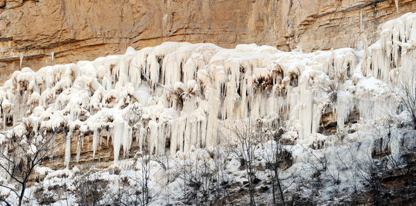 Grand ice fall on mountain cliffs in N China