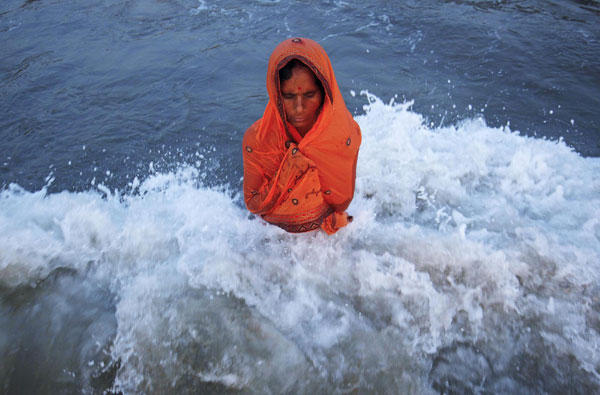 Hindu devotees pray to Sun god