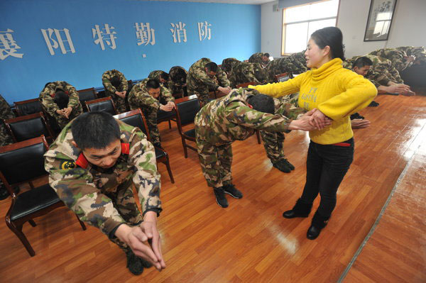 Homesick firefighters practice yoga