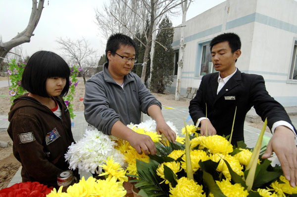 Cemetery worker helps keep resting place neat