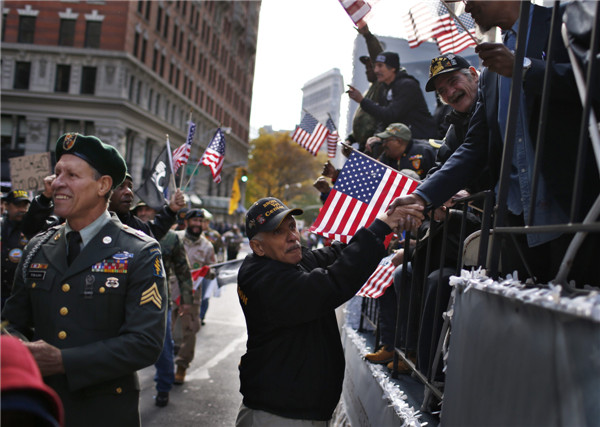 US honors its veterans with ceremonies, parades