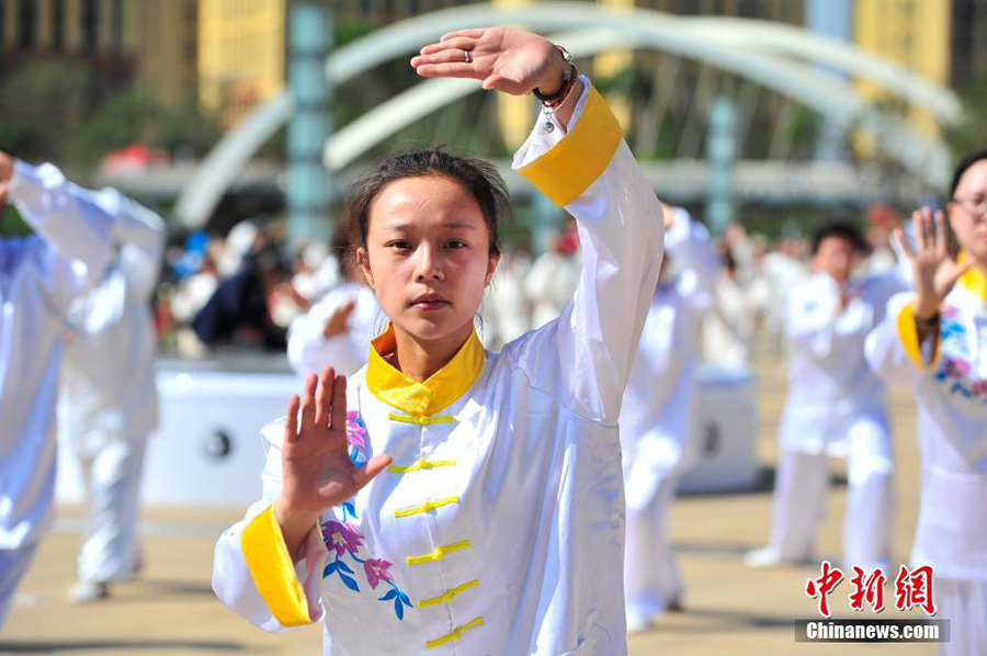 Hundreds of people practice tai chi in spring