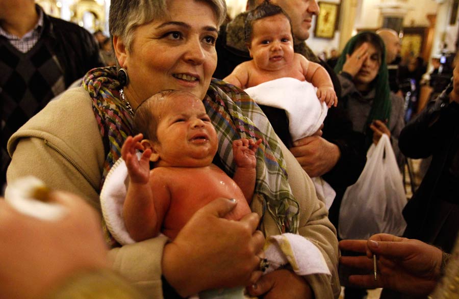 Babies baptized during a mass ceremony