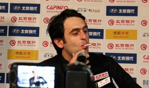 Ebdon beats Ding; smoking O'Sullivan criticized