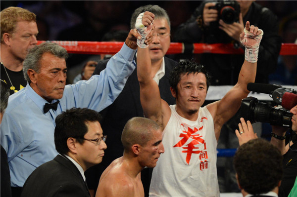 China's Zou Shiming wins third pro bout